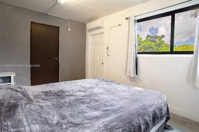 bedroom with a wall unit AC