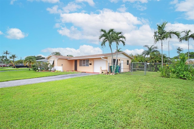 view of front of home with a garage and a front yard