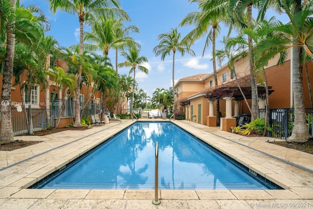 view of swimming pool featuring area for grilling