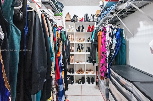 walk in closet featuring tile patterned flooring