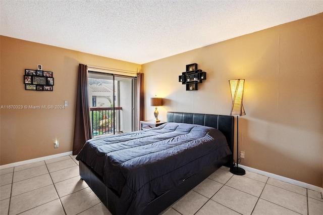 bedroom featuring a textured ceiling and light tile patterned floors