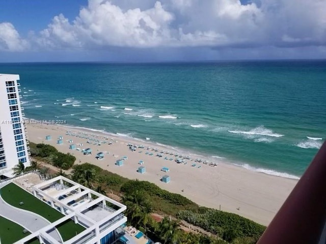 bird's eye view featuring a beach view and a water view