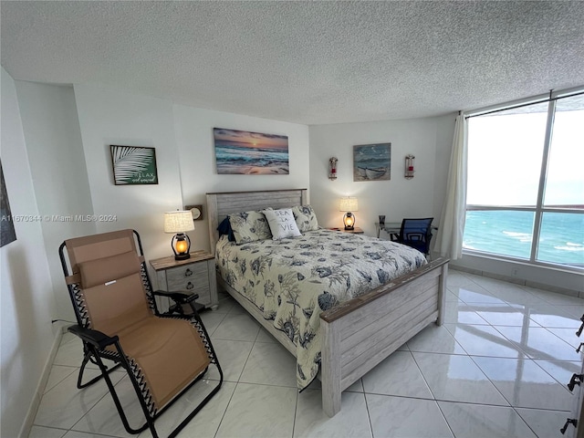 tiled bedroom with a textured ceiling