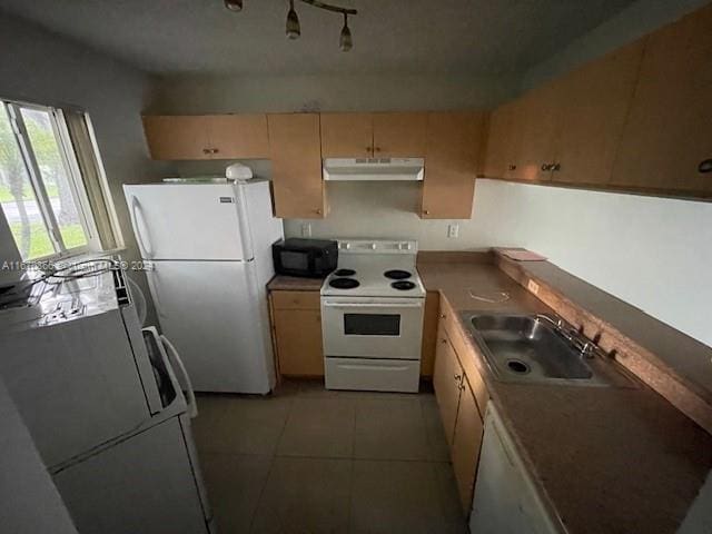 kitchen with white appliances, light brown cabinets, light tile patterned floors, and sink