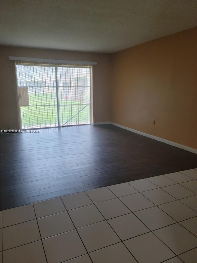 spare room featuring hardwood / wood-style floors