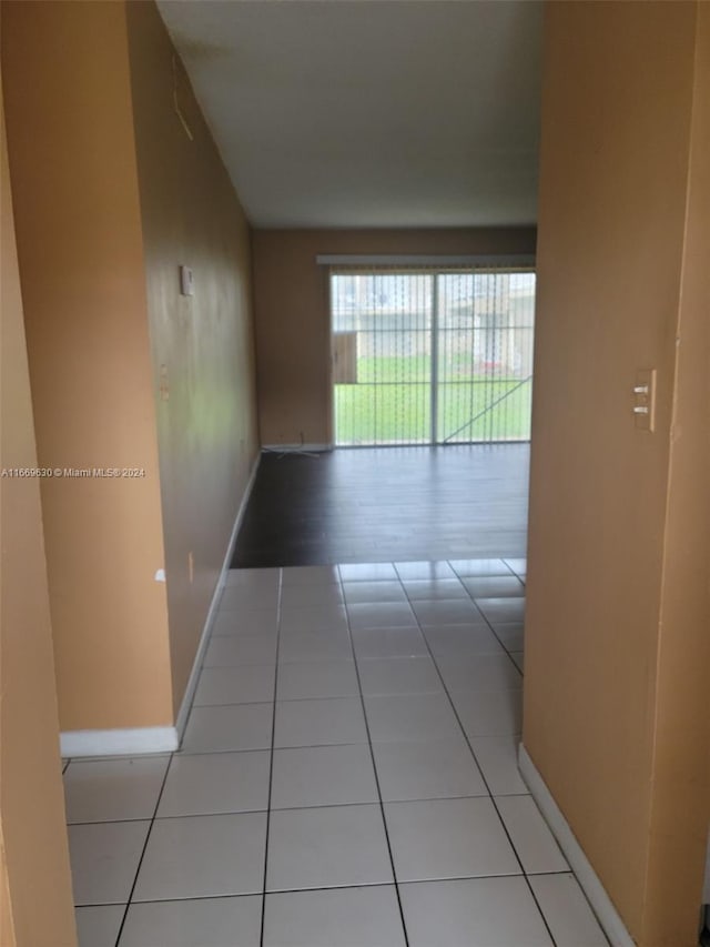 hallway with light tile patterned floors