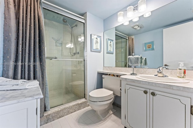 bathroom featuring vanity, tile patterned flooring, toilet, and a shower with door