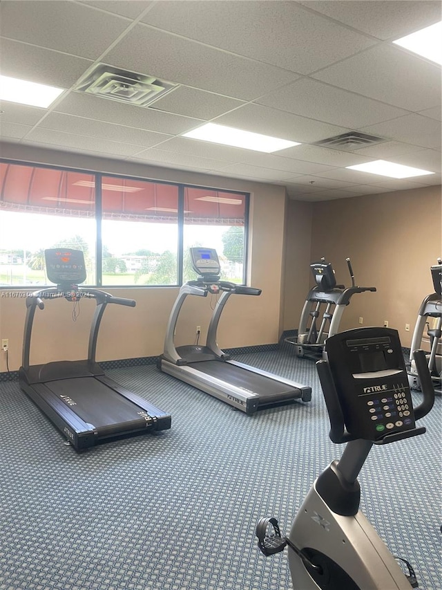 gym featuring a paneled ceiling