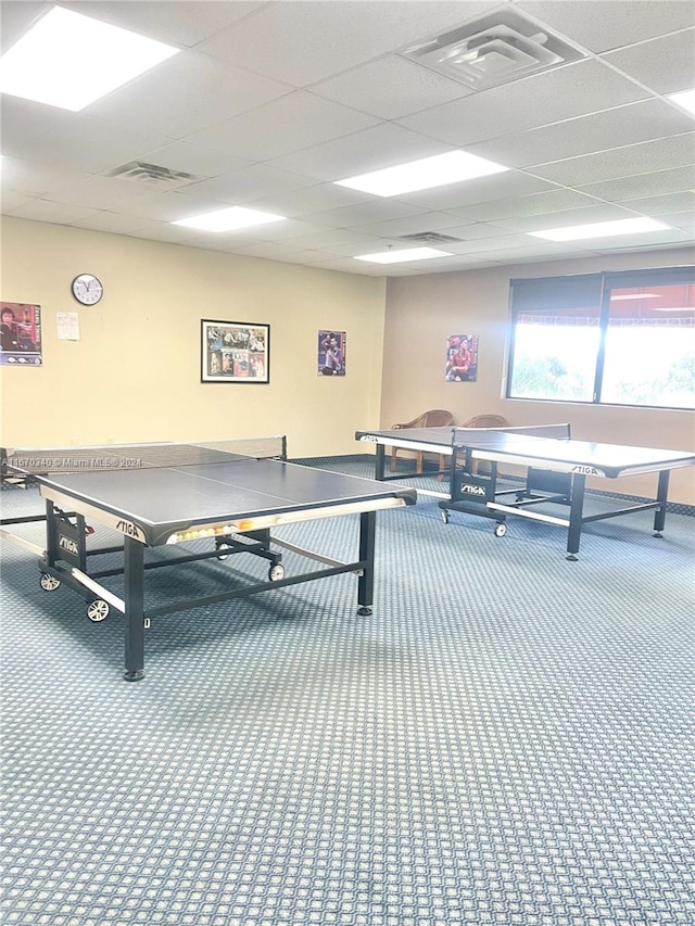 game room featuring a drop ceiling and carpet flooring