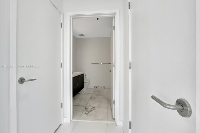 851 NE 1st Ave Unit 2200, Miami, FL 33132 - bathroom featuring marble finish floors, vanity, and toilet