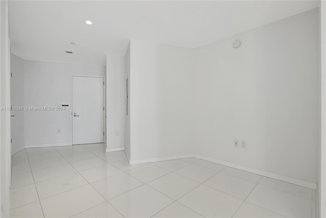 851 NE 1st Ave Unit 2200, Miami, FL 33132 - unfurnished room with baseboards, light tile patterned floors, a smoke detector, and recessed lighting