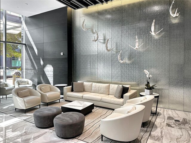 851 NE 1st Ave Unit 2200, Miami, FL 33132 - community lobby with floor to ceiling windows and a high ceiling