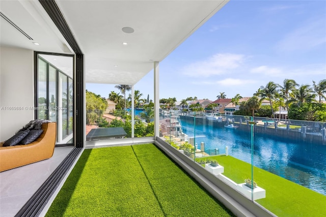 balcony featuring a water view