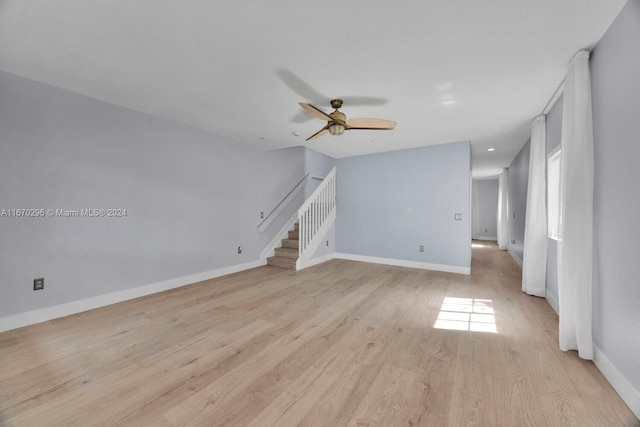 unfurnished living room with ceiling fan and light hardwood / wood-style floors