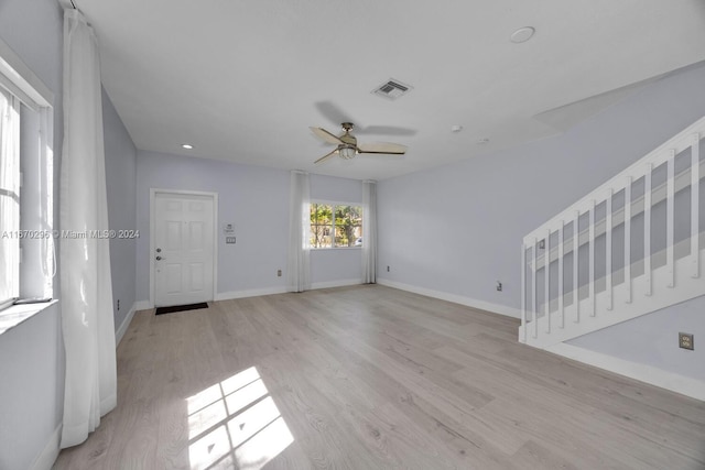 empty room featuring light hardwood / wood-style floors and ceiling fan