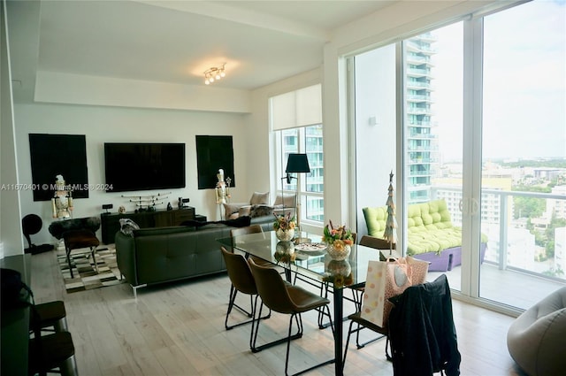 dining area featuring light wood-type flooring