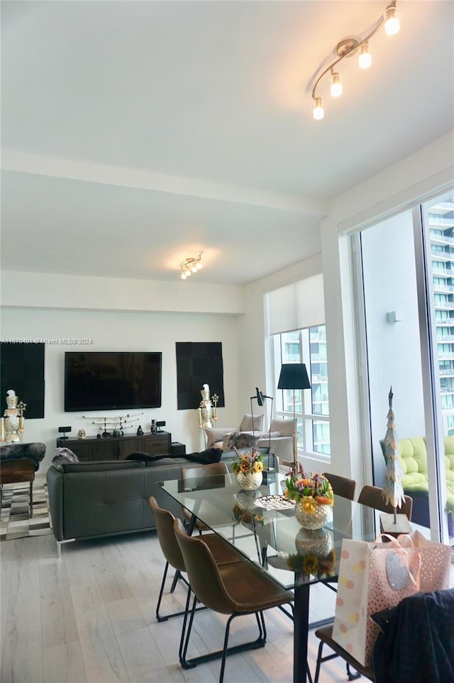 dining area featuring light wood-type flooring