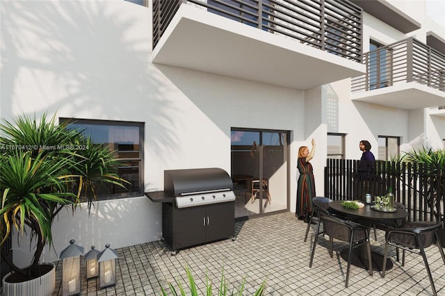 view of patio / terrace featuring grilling area and a balcony