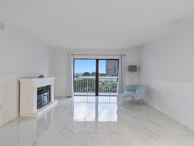 unfurnished living room with a premium fireplace