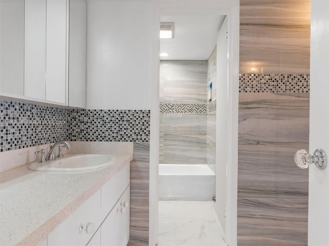 bathroom with independent shower and bath, vanity, tile walls, and backsplash