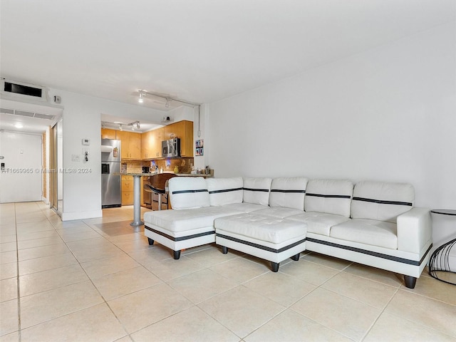 living room with light tile patterned floors