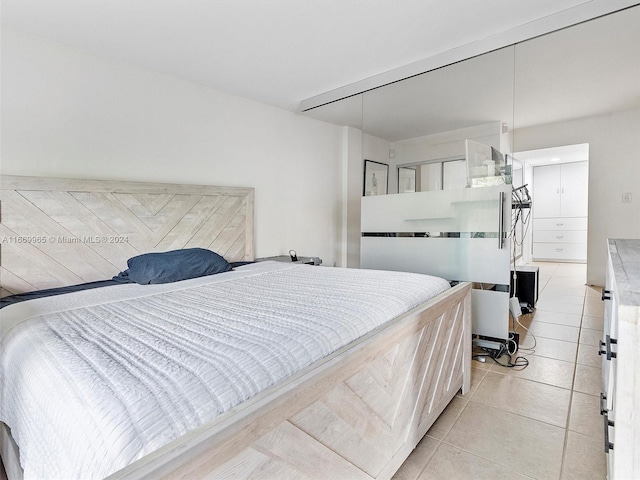 bedroom featuring light tile patterned flooring