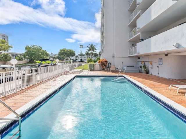 view of swimming pool with a patio area