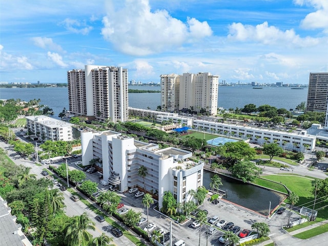 birds eye view of property with a water view