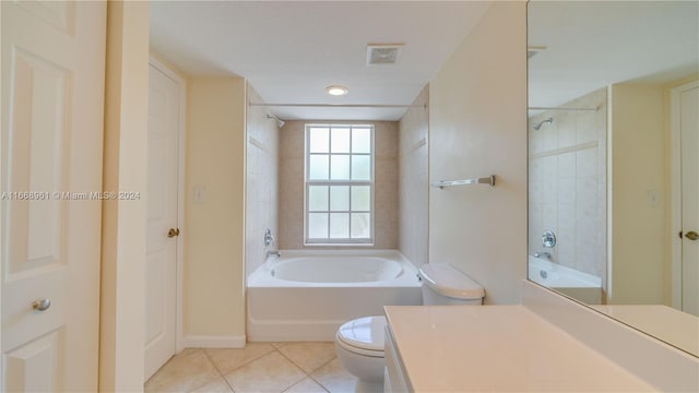 bathroom with vanity, tile patterned flooring, and toilet