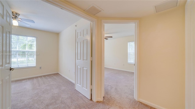 corridor with light colored carpet