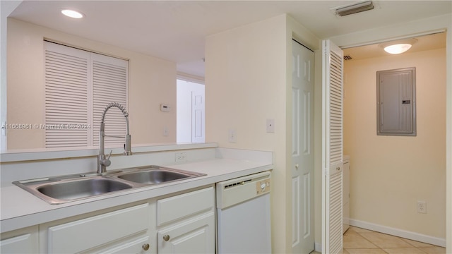 kitchen with light tile patterned flooring, electric panel, sink, white cabinetry, and dishwasher