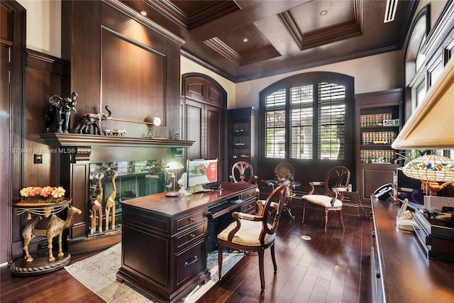 office space with coffered ceiling, dark wood-type flooring, wood walls, crown molding, and beam ceiling