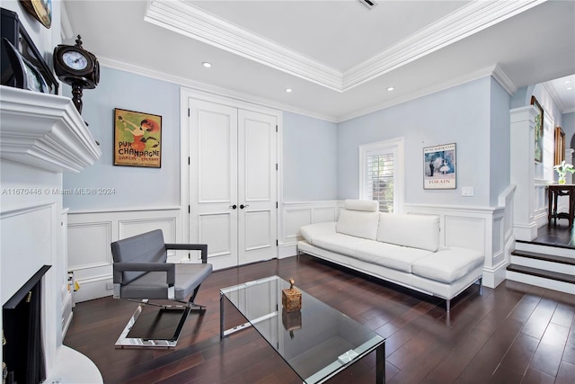 living room with ornamental molding and dark hardwood / wood-style flooring