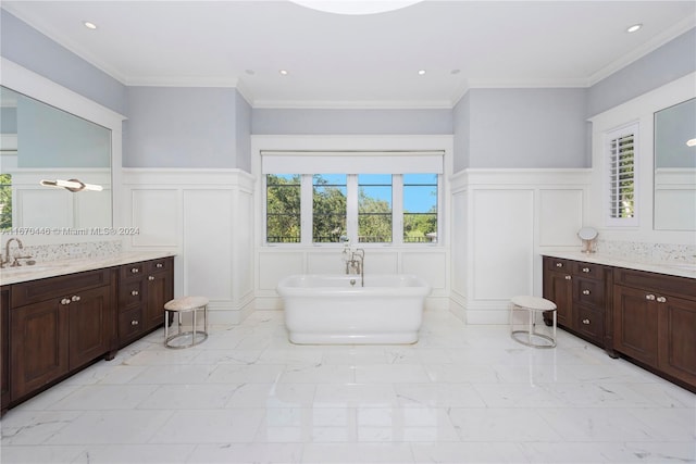 bathroom with a tub to relax in, plenty of natural light, and vanity