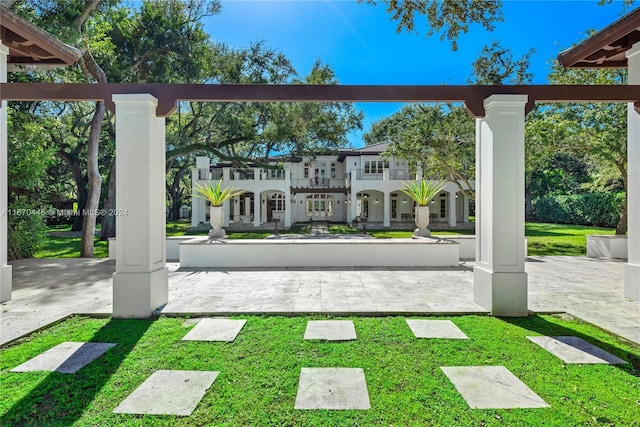 surrounding community featuring a patio and a yard