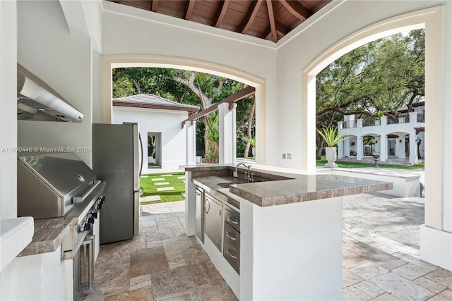 view of patio / terrace featuring sink and an outdoor kitchen