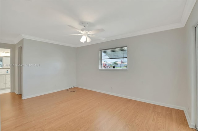 unfurnished room with light wood-type flooring, ornamental molding, and ceiling fan