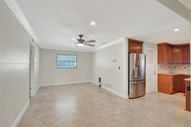 kitchen featuring ceiling fan, light tile patterned floors, stainless steel refrigerator with ice dispenser, crown molding, and decorative backsplash