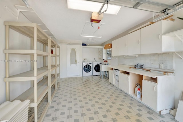 laundry area with sink and washing machine and dryer