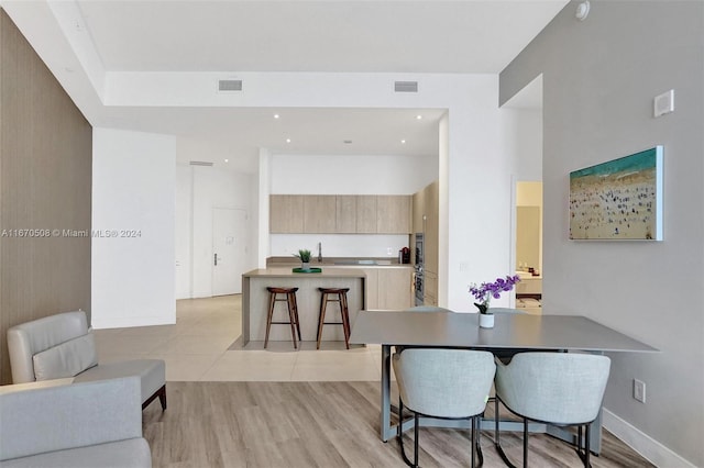 dining room with light hardwood / wood-style floors