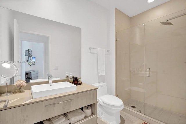 bathroom featuring tile patterned flooring, vanity, toilet, and an enclosed shower