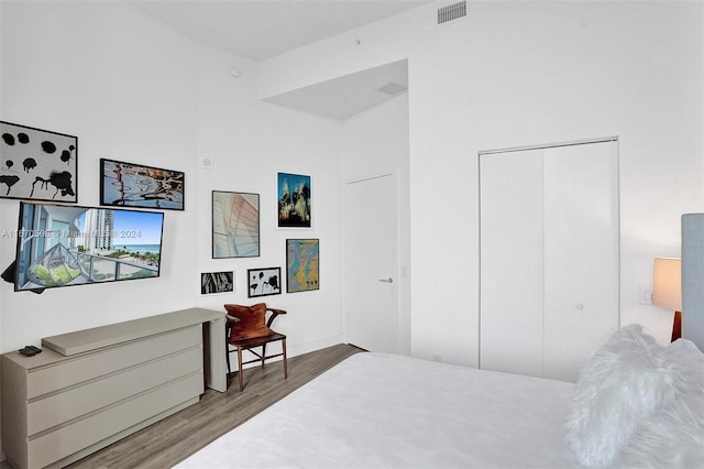 bedroom featuring a closet and hardwood / wood-style flooring