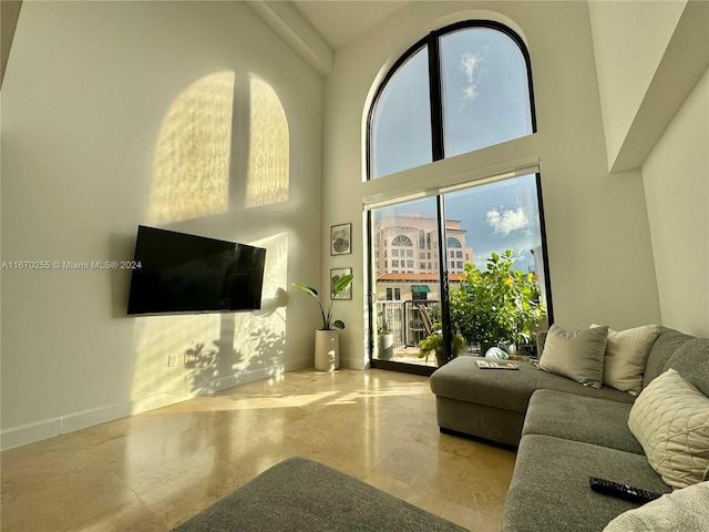 living room with a towering ceiling