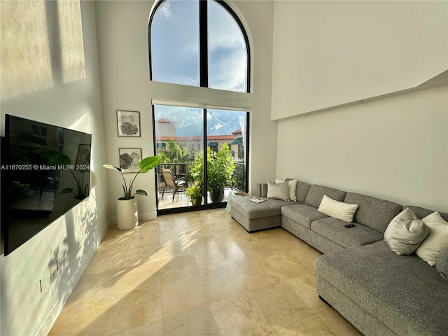 living room featuring a high ceiling