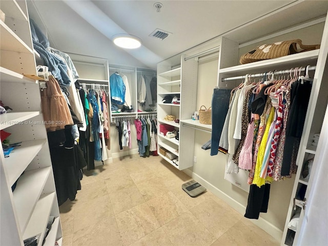 spacious closet featuring lofted ceiling