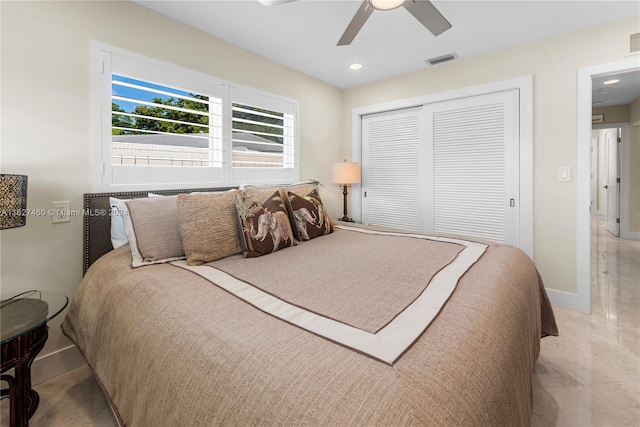 bedroom featuring ceiling fan and a closet