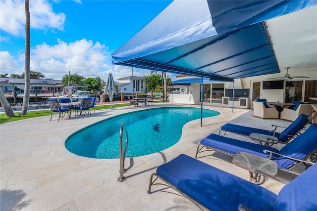 view of pool featuring a patio area and ceiling fan