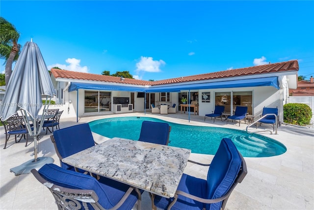 view of swimming pool with a patio