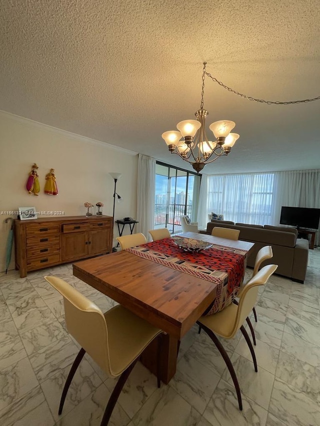 dining area featuring a notable chandelier, a textured ceiling, and ornamental molding