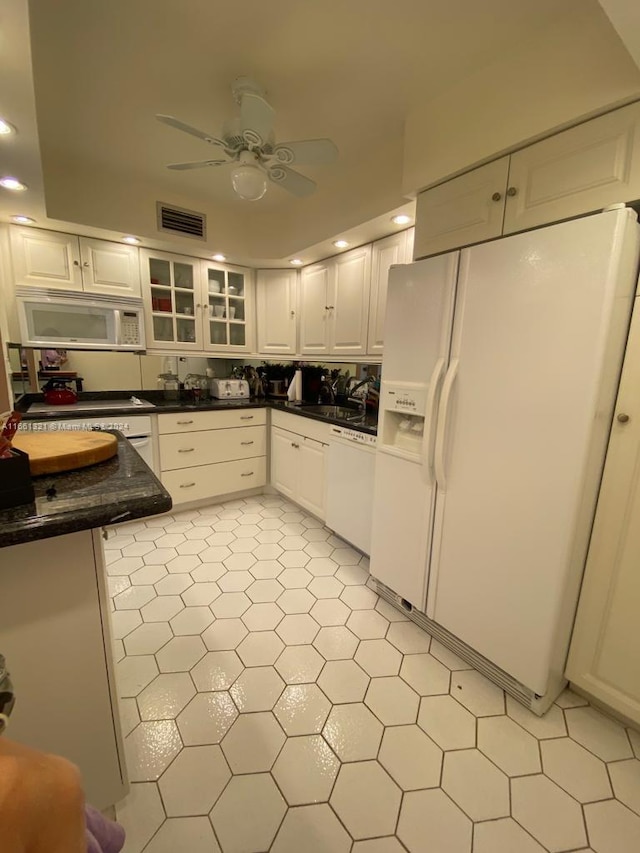 kitchen with white cabinetry, light tile patterned flooring, white appliances, ceiling fan, and sink